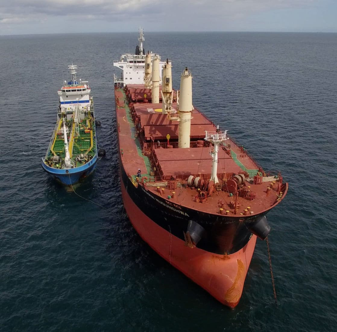 Bunker vessel alongside a cargo ship